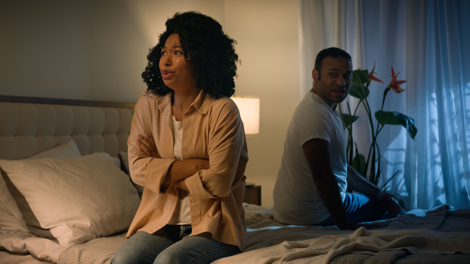 Couple family relationship problem conflict misunderstanding quarrel African American woman wife girlfriend angry mad husband boyfriend man sitting on bed night quarrelling screaming shouting arguing